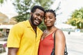 Young afircan american couple smiling happy and hugging at the city