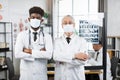 Two medical workers in face masks posing indoors Royalty Free Stock Photo