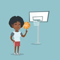 Young african basketball player spinning a ball. Royalty Free Stock Photo