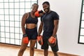 Young african american boxer couple smiling happy standing at sport center Royalty Free Stock Photo