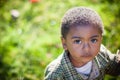 Young African american boy looking up at camera Royalty Free Stock Photo