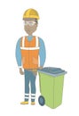 Young african-american builder pushing recycle bin