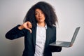 Young african american business woman with afro hair using computer laptop from job with angry face, negative sign showing dislike Royalty Free Stock Photo