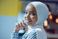 Young African American business woman sitting at her desk and smiling Royalty Free Stock Photo