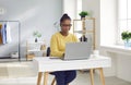 Young african american business woman working with laptop computer at home or at office. Royalty Free Stock Photo