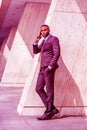 Young African American Businessman with beard talking on cell phone outside office in New York Royalty Free Stock Photo