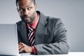 Young African American Businessman Being Sneaky On Laptop Royalty Free Stock Photo