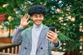 Young african american businessman doing video call using smartphone at the park Royalty Free Stock Photo