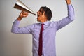 Young african american businessman screaming using vintage megaphone Royalty Free Stock Photo