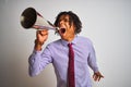 Young african american businessman screaming using vintage megaphone Royalty Free Stock Photo