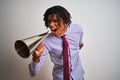 Young african american businessman screaming using vintage megaphone Royalty Free Stock Photo