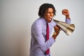 Young african american businessman screaming using vintage megaphone Royalty Free Stock Photo