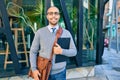 Young african american businessman smiling happy holding clipboard with agreement document at the city Royalty Free Stock Photo