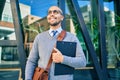 Young african american businessman smiling happy holding clipboard with agreement document at the city Royalty Free Stock Photo