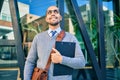 Young african american businessman smiling happy holding clipboard with agreement document at the city Royalty Free Stock Photo