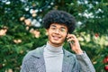 Young african american businessman smiling happy talking on the smartphone at the park Royalty Free Stock Photo