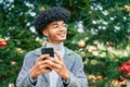 Young african american businessman smiling happy  using smartphone at the park Royalty Free Stock Photo