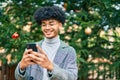 Young african american businessman smiling happy  using smartphone at the park Royalty Free Stock Photo