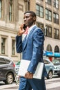 Young African American businessman talking on cell phone, travel Royalty Free Stock Photo