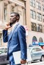 Young African American businessman talking on cell phone, traveling, working in New York Royalty Free Stock Photo