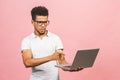 Young african american businessman using computer laptop annoyed and frustrated shouting with anger, crazy and yelling with raised Royalty Free Stock Photo