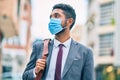 Young african american businessman wearing medical mask at the city Royalty Free Stock Photo