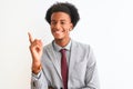 Young african american businessman wearing suit standing over isolated white background with a big smile on face, pointing with Royalty Free Stock Photo