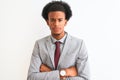 Young african american businessman wearing suit standing over isolated white background skeptic and nervous, disapproving Royalty Free Stock Photo