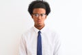 Young african american businessman wearing tie and glasses over isolated white background puffing cheeks with funny face