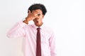 Young african american businessman wearing tie standing over isolated white background peeking in shock covering face and eyes Royalty Free Stock Photo