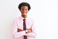 Young african american businessman wearing tie standing over  white background happy face smiling with crossed arms Royalty Free Stock Photo