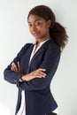 Young african american businesswoman posing against white background with her arms crossed Royalty Free Stock Photo