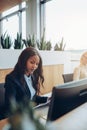 Focused young African American businesswoman working at her offi Royalty Free Stock Photo