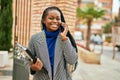 Young african american businesswoman smiling happy talking on the smartphone at the city Royalty Free Stock Photo