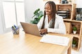 Young african american businesswoman smiling happy working at the office Royalty Free Stock Photo