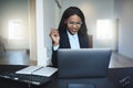 Young African American businesswoman smiling while working on a Royalty Free Stock Photo