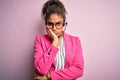 Young african american call center agent girl wearing glasses working using headset thinking looking tired and bored with Royalty Free Stock Photo