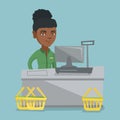 Cashier standing at the checkout in a supermarket. Royalty Free Stock Photo