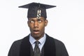 Young African American college graduate with tuition debt price tag, horizontal Royalty Free Stock Photo