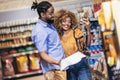 African american couple buying accessories for pets