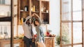 Young african-american couple dancing in kitchen, copy space Royalty Free Stock Photo