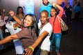 Young African American couple enjoying a night out at a nightclub, engaging in close dancing