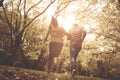 African American couple running and catching in park. From Royalty Free Stock Photo