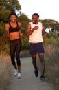 Young african american couple running outside Royalty Free Stock Photo