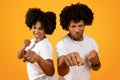 Young african american couple showing fists on background Royalty Free Stock Photo