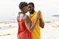 Young african american couple smiling happy dancing at the beach Royalty Free Stock Photo