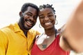 Young african american couple smiling happy making selfie by the camera at the beach Royalty Free Stock Photo