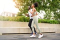 Young African American couple in sportswear running in public park. Jogging healthy concept Royalty Free Stock Photo