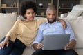 Young African American couple using laptop computer at homes Royalty Free Stock Photo