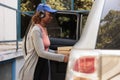 Young african american courier delivering pizza order by car Royalty Free Stock Photo